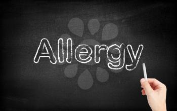 Allergy written on white blackboard
