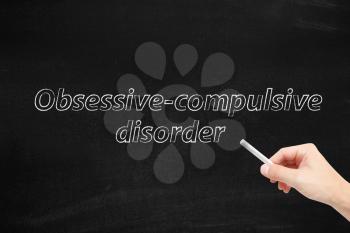Obsessive compulsive disorder written on a blackboard