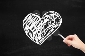 Heart written on a blackboard