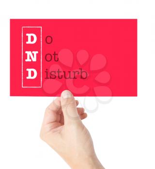 Do Not Disturb explained on a card held by a hand