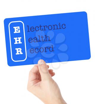 Electronic Health Record explained on a card held by a hand