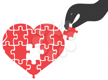isolated hand took heart jigsaw puzzle piece on white background