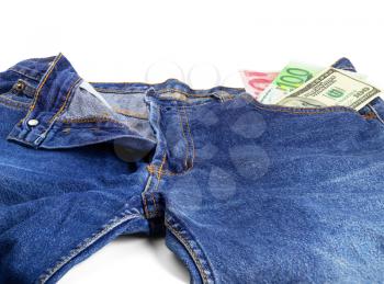 money bills on pocket of a pair of blue jeans