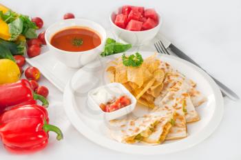 original Mexican quesadilla de pollo with nachos  served with gazpacho soup and watermelon ,with fresh vegetables on background,MORE DELICIOUS FOOD ON PORTFOLIO