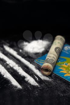 cocaine drug powder over black abuse concept 