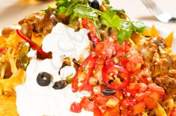 fresh nachos and vegetable salad with meat ,chili con carne  ,tipycal mexican food
