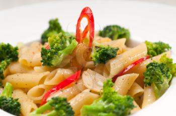 classic Italian penne pasta with broccoli and red chili pepper