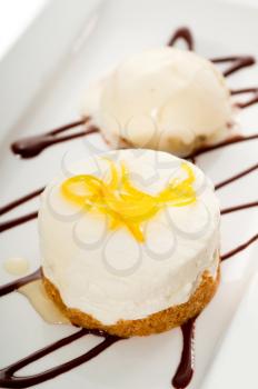 very elegant lemon mousse dessert served whith lemon peel on top and vanilla ice cream on side, MORE DELICIOUS FOOD ON PORTFOLIO