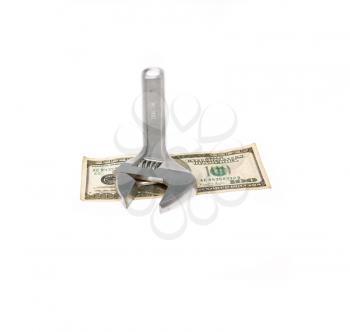 wrench tool fixing dollar bill isolated on white background  closeup