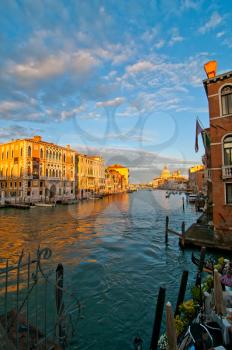 Venice Italy grand canal view from the top of Accademia bridge with Madonna della Salute church on background at sunset