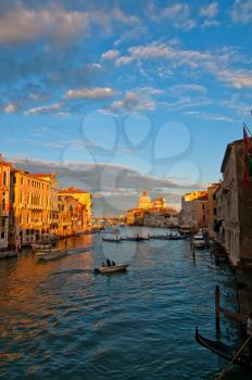 Venice Italy grand canal view from the top of Accademia bridge with Madonna della Salute church on background at sunset