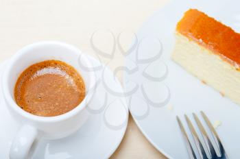 italian espresso coffee and cheese cake over white wood table