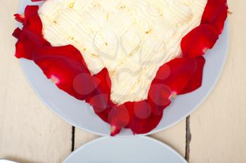 whipped cream mango cake with red rose petals 