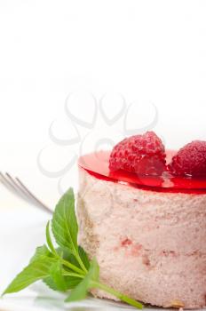 fresh raspberry cake mousse dessert round shape with mint leaves