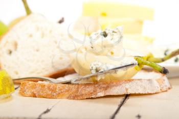 selection of different cheese and fresh pears appetizer snack 