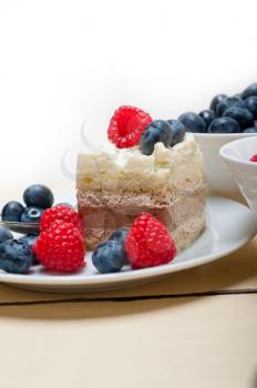 fresh homemade raspberry and blueberry cream cake 