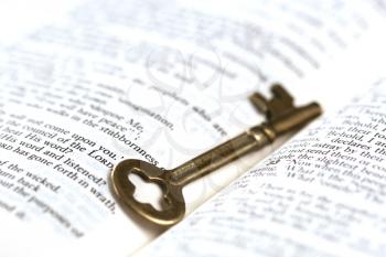 Royalty Free Photo of a Key on a Bible