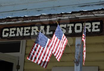 Royalty Free Photo of a General Store Sign With Flags
