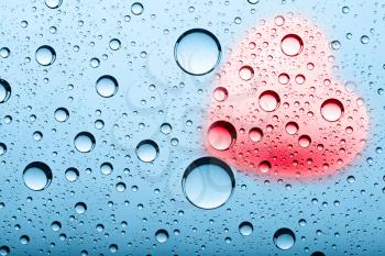 Royalty Free Photo of a Water Drop Background With a Heart