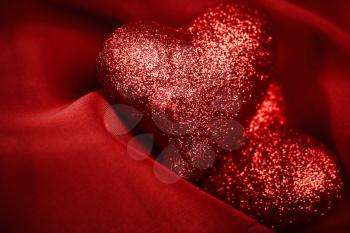abstract Valentine's backgrounds over red textile with tho hearts