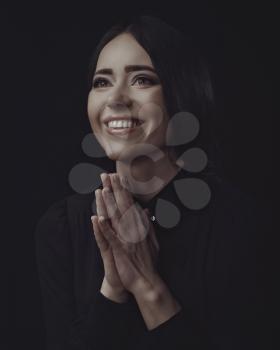 Beautiful actress, positive expressed female portrait against dark background