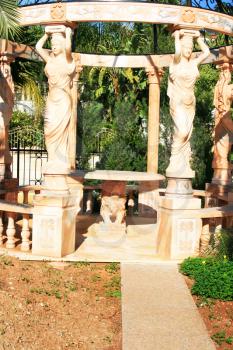 Royalty Free Photo of a Marble Arbor With Statues