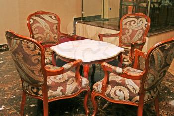 Royalty Free Photo of Chairs Around a Table