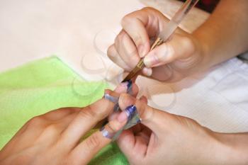 Royalty Free Photo of a Woman Getting a Manicure