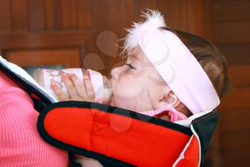 Royalty Free Photo of a Baby Girl Drinking Milk