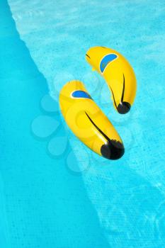 Royalty Free Photo of Inflatable Bananas in a Swimming Pool