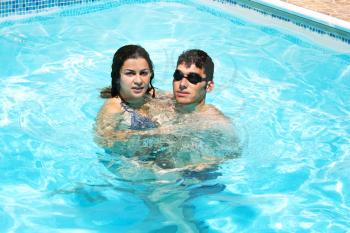 Royalty Free Photo of a Couple in a Swimming Pool