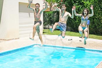 Royalty Free Photo of People Jumping into a Swimming Pool