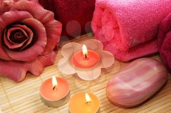 Royalty Free Photo of Candles by Towels