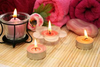 Royalty Free Photo of Candles by Towels