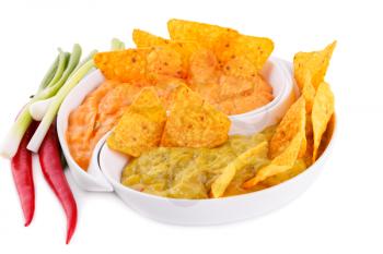 Nachos, guacamole and cheese sauce, vegetables isolated on white background.