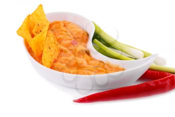 Nachos,  cheese sauce, vegetables isolated on white background.