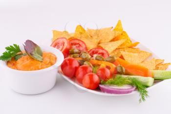 Vegetables, olives, nachos and cheese sause image.