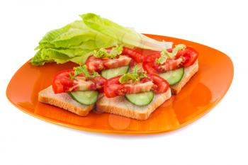 Rusk sandwiches with lettuce, tomato, cucumber on plate isolated on white background.