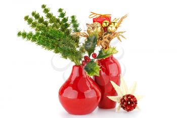 Christmas decoration in red vases isolated on white background.