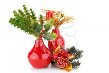 Christmas decoration in red vases isolated on white background.