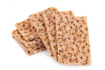 Pile of crackers with sesame seeds isolated on white background.