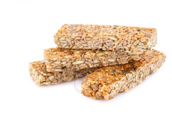 Cereal bars with different seeds isolated on white background.