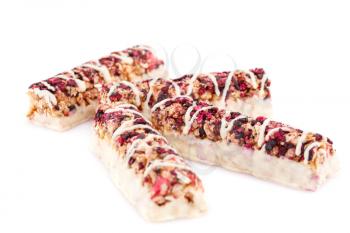 Cereal bars with different berries and seeds isolated on white background.