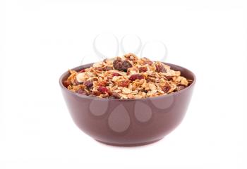 Muesli in the bowl isolated on white background.