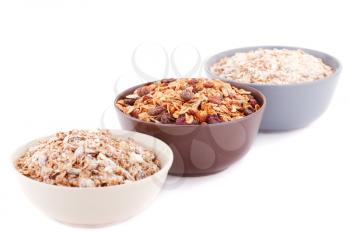 Musli in the bowl isolated on white background.