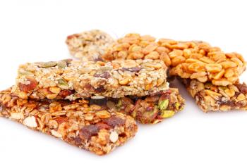 Muesli bars with different nuts isolated on white background.