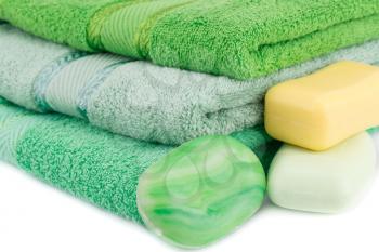 Colorful towels and soaps closeup picture.