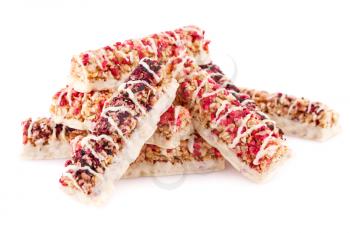 Cereal bars with different berries and seeds isolated on white background.