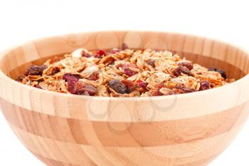 Muesli in the bowl on white background.