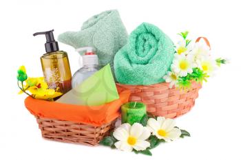 Spa set with towels, soaps, candles and flowers isolated on white background.